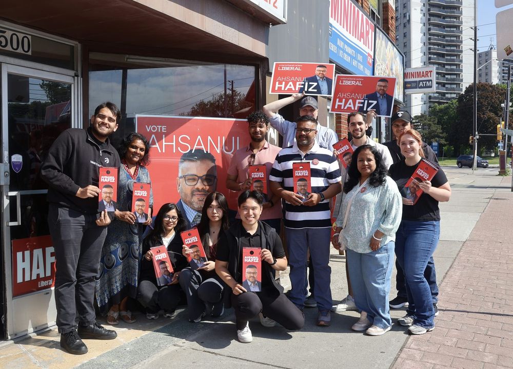 Ahsanul Hafiz and a large group of volunteers outside the campaign office before a canvass