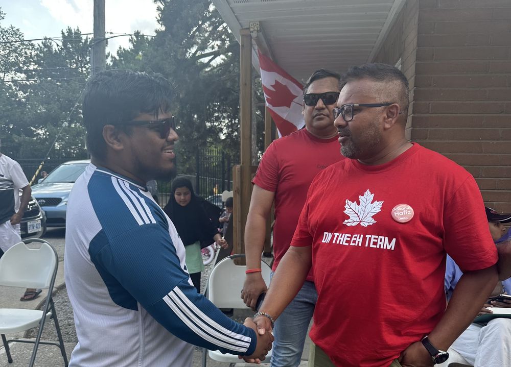 Ahsanul Hafiz meeting a neighbour at a Canada Day event
